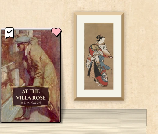 A framed print above a spine shelf.